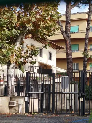 a black fence in front of a building at Gemelli Flower's House in Rome