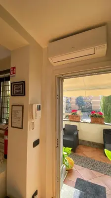 a room with a door leading to a room with a window at Gemelli Flower's House in Rome