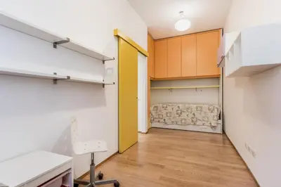 a room with a closet and a couch in it at Alloggio Chigi in Rome