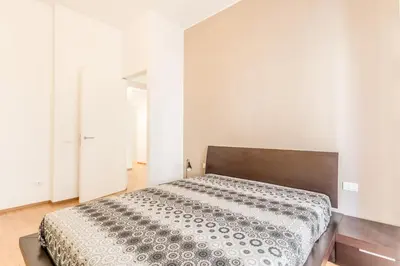 a bedroom with a large bed in a room at Alloggio Chigi in Rome