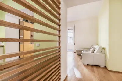 a sliding barn door in a living room at Alloggio Chigi in Rome