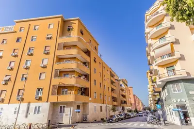 a yellow building on the side of a street at Alloggio Chigi in Rome
