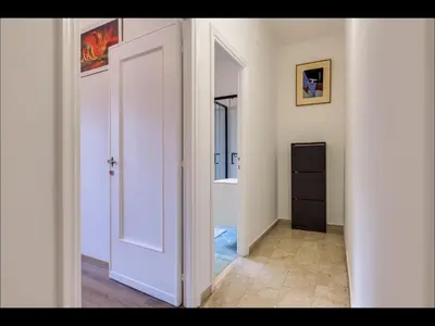 a hallway with an open door to a bathroom at L aROMA ANTICA in Rome