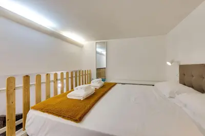 a bedroom with a bed with towels on it at Trastevere Experience in Rome