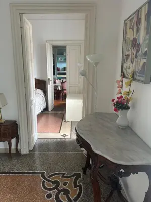 a room with a table and a room with a bedroom at Nel cuore di Roma in Rome
