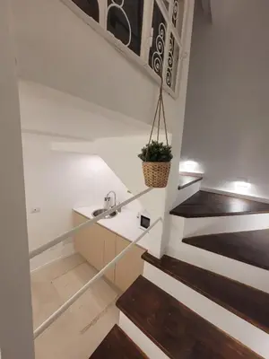 a staircase in a house with a sink and some stairs at Mini Loft MaDi' in Rome