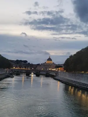 a bridge over a river with a city in the background at Mini Loft MaDi' in Rome