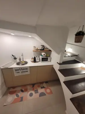 a kitchen with a sink and a microwave at Mini Loft MaDi' in Rome