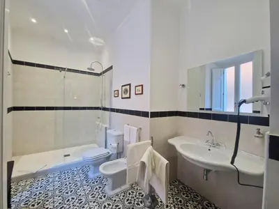 a bathroom with a sink and a toilet and a shower at Angel's Garden in Rome