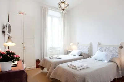 a bedroom with two beds with towels on them at B&B Ondina in Rome