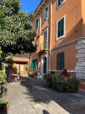 an empty street in front of a building at La casina sull'appia in Rome