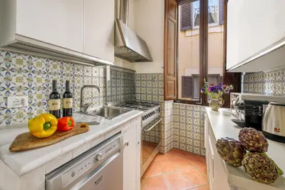 a bathroom with a sink and a toilet and a tub at NOBILIA - Roof Garden Penthouse near Navona Square in Rome