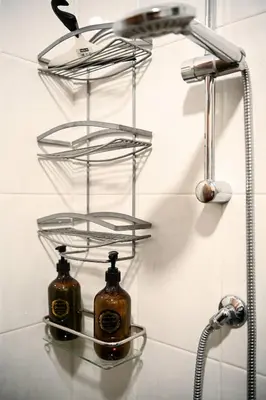 two bottles of soap on a shelf in a bathroom at Romina in Rome
