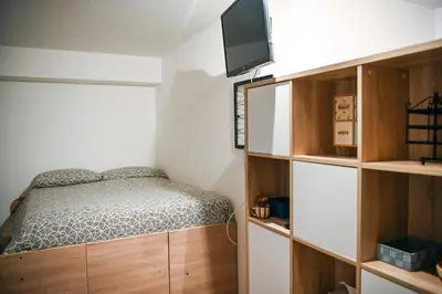 a bedroom with a bed and a flat screen tv at Romina in Rome