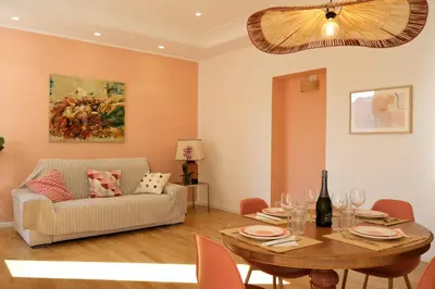 a living room with a table and a couch at Casa Frida Arte e Sport tra MAXXI e Olimpico in Rome
