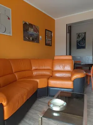 a living room with a couch and a table at Casa Oscar in Rome