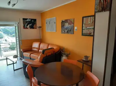 a living room with a couch and a table at Casa Oscar in Rome