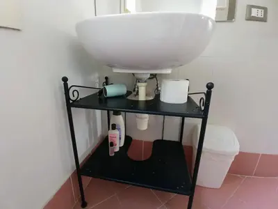 a bathroom with a sink and a toilet at Bed Bike Breakfast al centro di Roma in Rome
