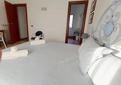 a large white bed with two pillows on it at Bed Bike Breakfast al centro di Roma in Rome