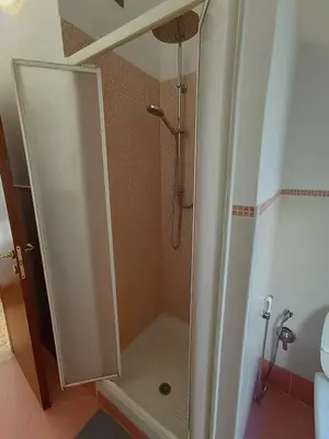 a shower with a glass door in a bathroom at Bed Bike Breakfast al centro di Roma in Rome