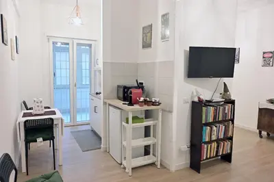 a hallway with white walls and a white door at Colli Albani Apartment in Rome