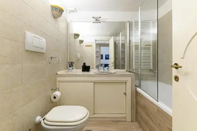 a bathroom with a toilet and a shower at Colosseum Apartment with Terrace by NDP rent in Rome