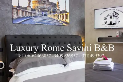 a bedroom with a bed and a picture of a bridge at Luxury Rome Savini Guest House in Rome