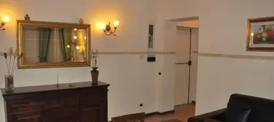 a living room with a mirror and a couch at Piazza Navona Apartment in Rome