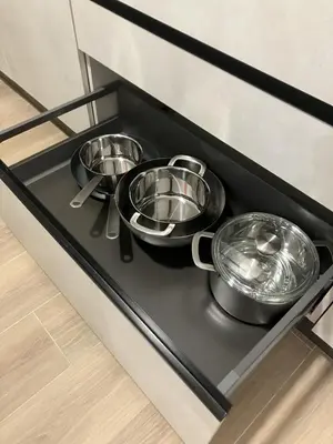three pans sitting on a stove in a kitchen at Blessed House in Rome