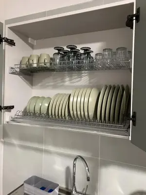 a kitchen with a shelf with pots and pans at Blessed House in Rome