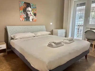 a bedroom with a bed with towels on it at Your Home at Vatican's doors in Rome