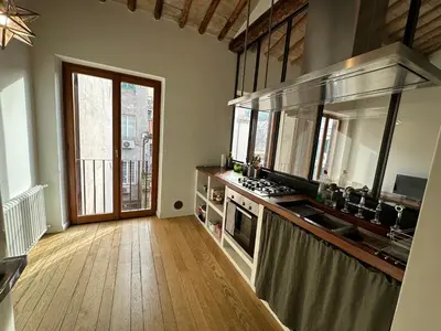 a kitchen with a sink and a counter top at Greci Suite in Rome