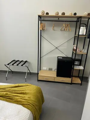 a bedroom with a bed and a tv on a shelf at Guest House Sinfonia sul Tevere in Rome