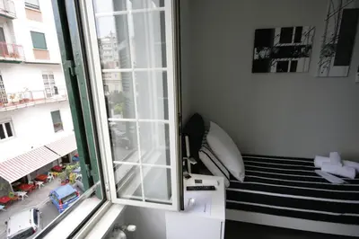 a room with a window and a stair case at Guest House Sinfonia sul Tevere in Rome