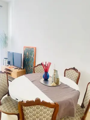a dining room with a table and chairs at Testaccio sul Tevere romantic historical close FAO in Rome