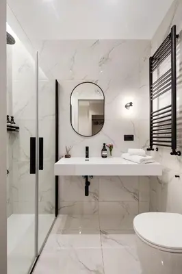 a white bathroom with a sink and a mirror at Piave Boutique Guest House in Rome