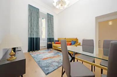 a living room with a table and a couch at Binario 30 in Rome