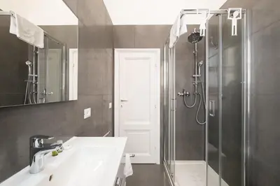 a bathroom with a sink and a shower at Domus Maggiore Apartment in Rome