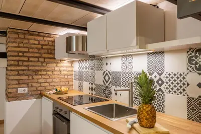 a kitchen with a sink and a pineapple on the counter at iFlat Cozy & Serene Loft Two Steps from Vatican in Rome