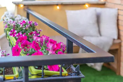 a bunch of flowers sitting on a table at San Pietro Panoramic View in Rome