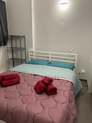 a bedroom with a bed with red towels on it at Al 304 a San Giovanni in Rome