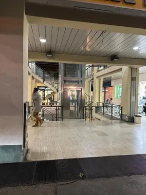 a person walking through a lobby of a building at Al 304 a San Giovanni in Rome