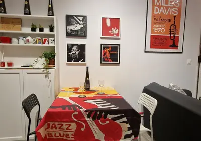 a dining room with a table with a tablecloth on it at Appartamento JazzNBlues House in Rome