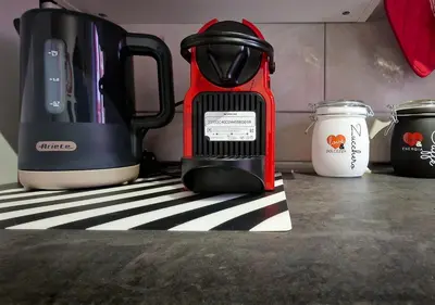 a red blender sitting on top of a counter at Appartamento JazzNBlues House in Rome