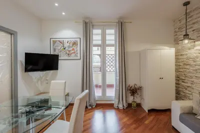 a living room with a glass table and a couch at Maison Riboty - by 101Flats in Rome