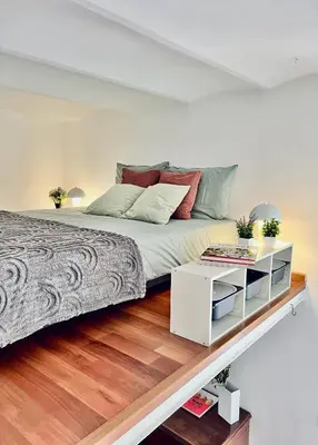 a bedroom with a large bed and a white cabinet at FlowflatPigneto in Rome