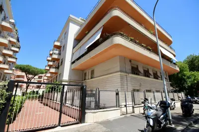 two motorcycles parked in front of a building at HC - CloHouse Spacious Flat in Rome