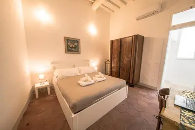 a bedroom with a bed with two towels on it at Casa degli Spagoli Navona Square in Rome