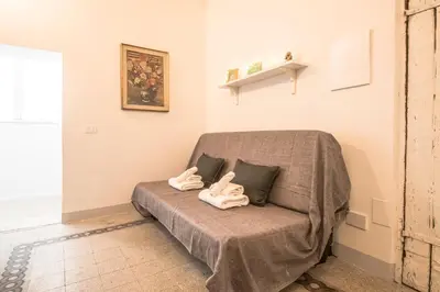a couch with two towel animals sitting on it at Casa degli Spagoli Navona Square in Rome