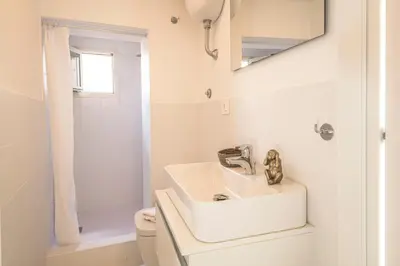 a white bathroom with a sink and a toilet at Casa degli Spagoli Navona Square in Rome